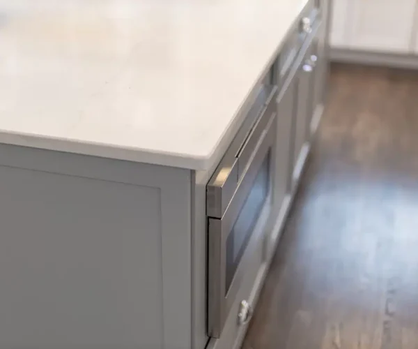 Gray shaker cabinet island with marble countertop, kitchen remodel by VKB Kitchen & Bath