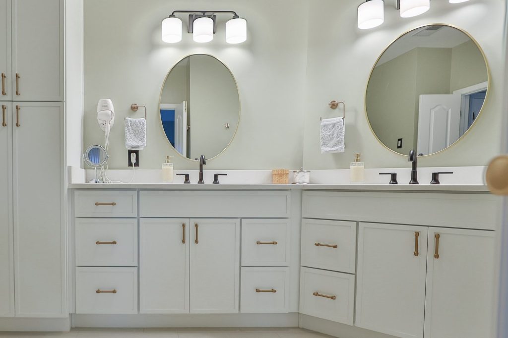 Double vanity with quartz top and round mirrors, Bethesda bathroom remodel