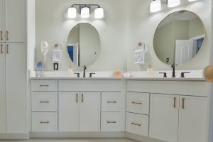 Double vanity with quartz top and round mirrors, Bethesda bathroom remodel