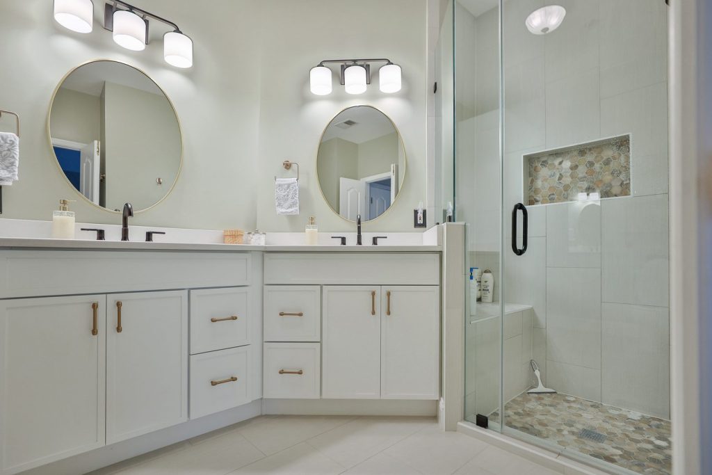 After — The vanity wall and the corner shower.