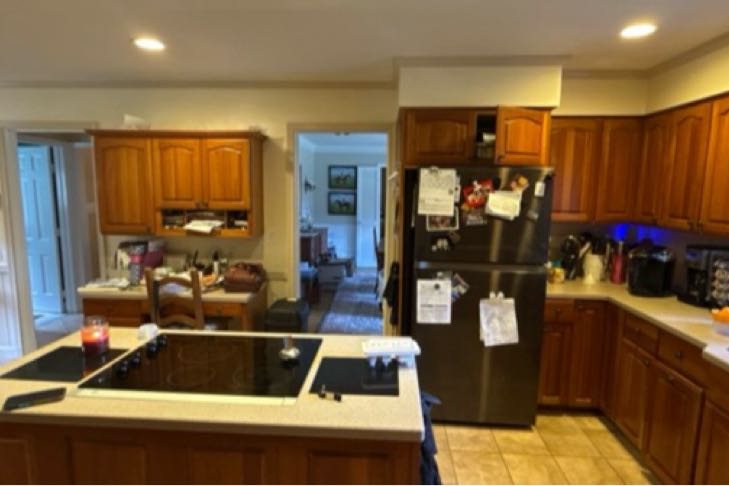 Bethesda kitchen before remodeling, dark stained cabinets and cooktop island