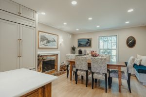 Dining room with fireplace beside the remodeled Bethesda kitchen