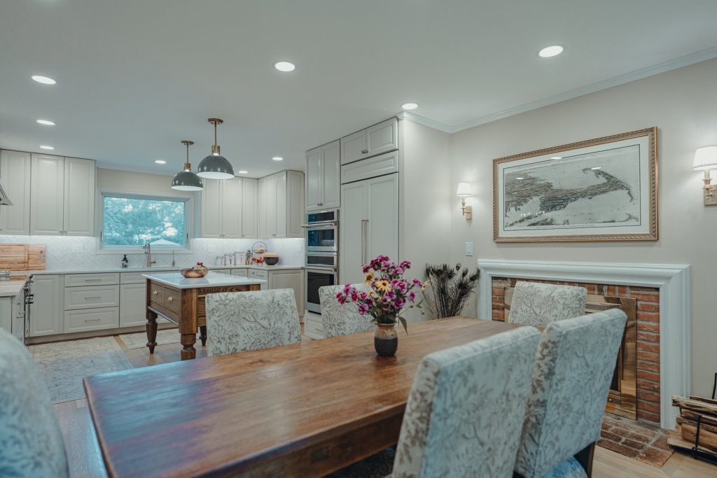 Open sightline from the remodeled Bethesda kitchen to the dining room fireplace