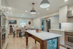 Remodeled Bethesda kitchen with a custom wood island and painted cabinetry