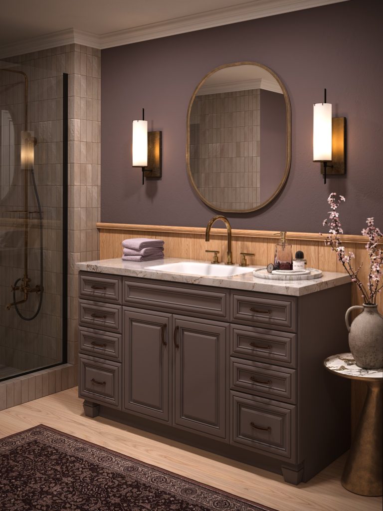 KraftMaid Vantage Chanlott dark vanity with an oval mirror in a plum bathroom