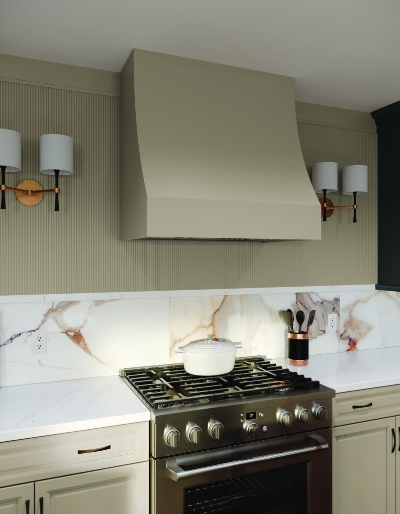 KraftMaid Vantage Knollwood kitchen with a fluted painted hood and marble slab backsplash